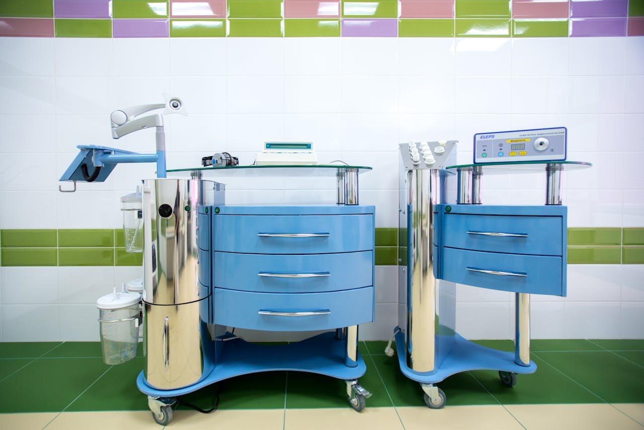 Two modern dental equipment carts in a sterile clinic environment, emphasizing hygiene.
